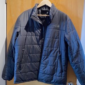 Large North Face down jacket in black.